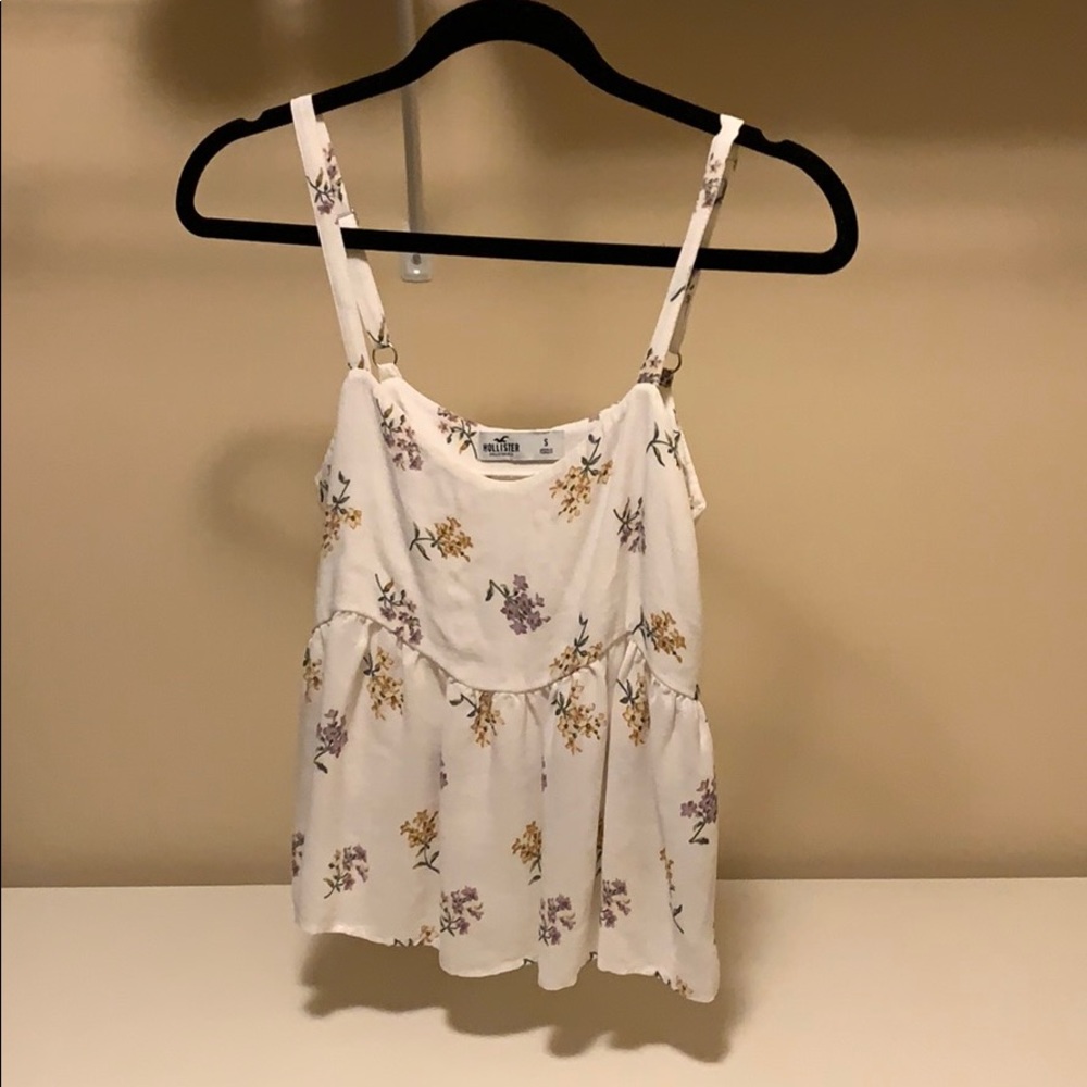 White tank top with a floral pattern.